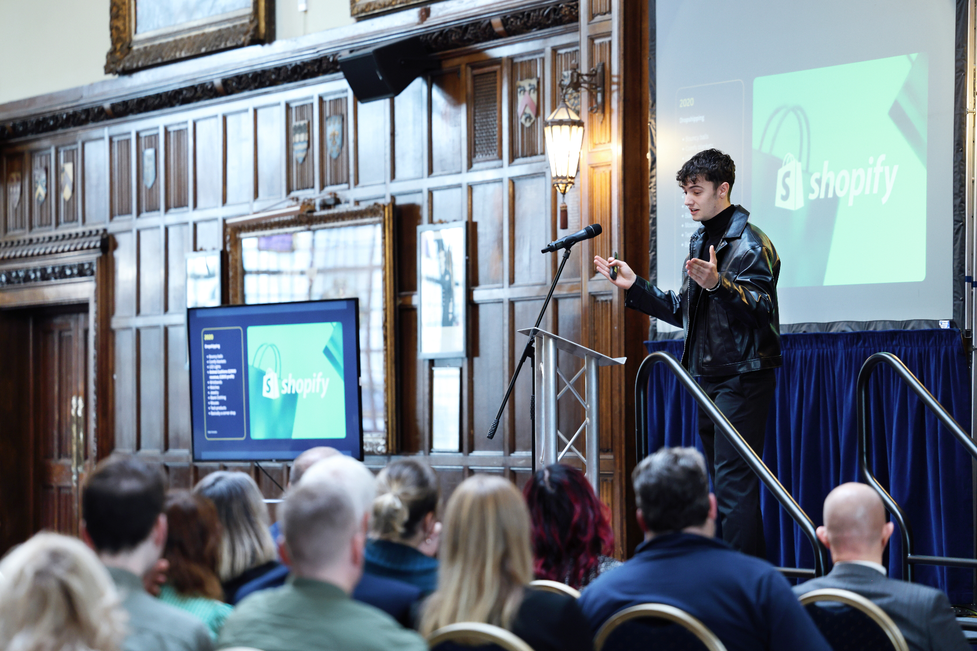 Owen Clater presenting to a seated audience